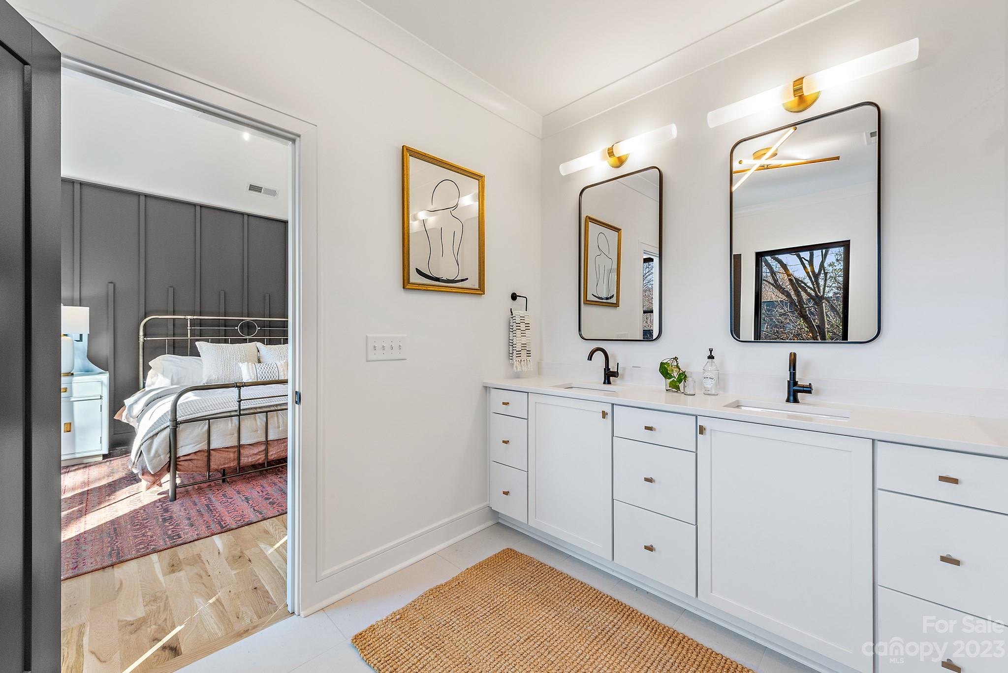 4338 Castleton Road Charlotte, NC 28211 - Photo 19 of 38 a spacious bathroom with a double vanity sink mirror and