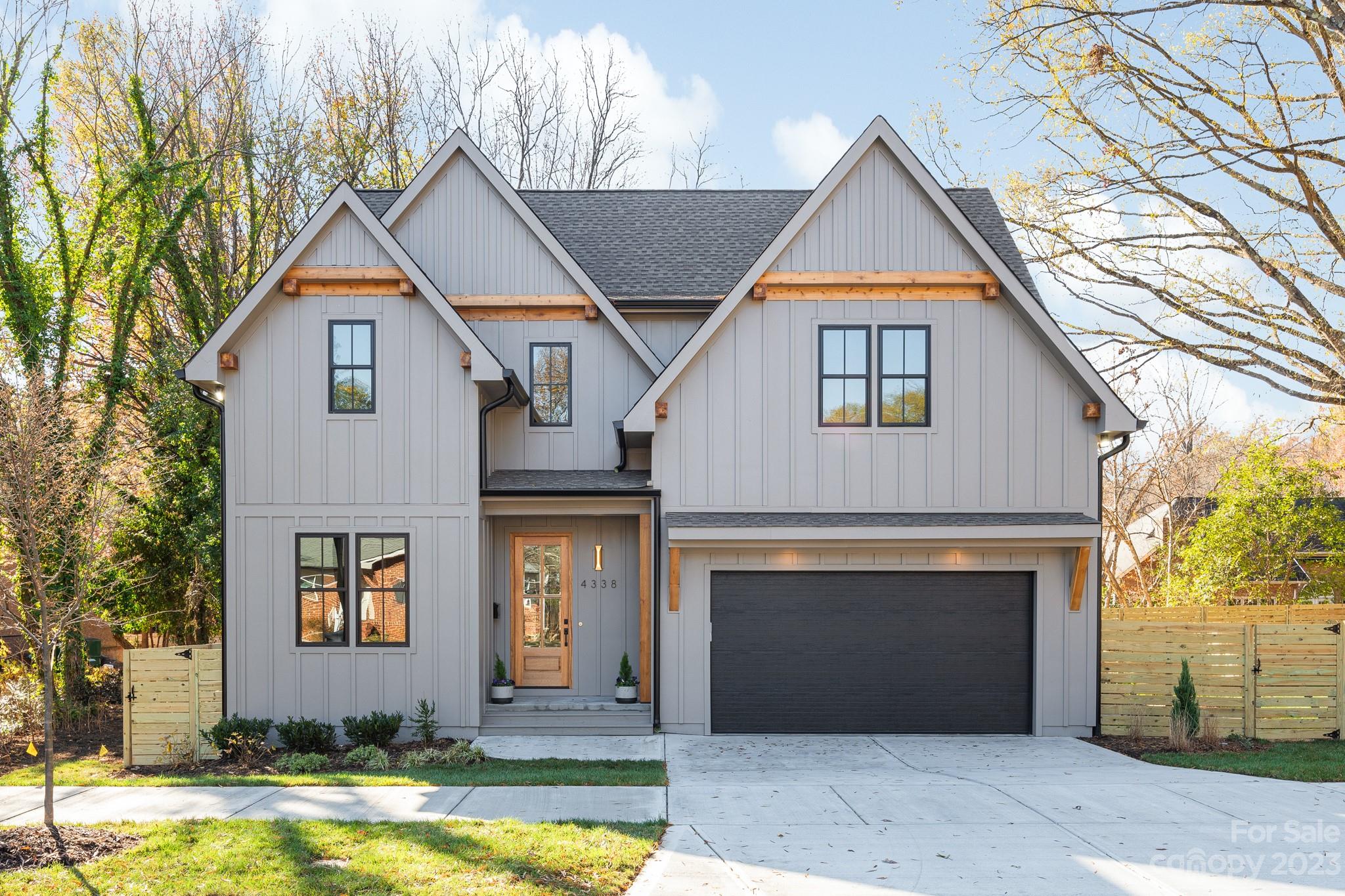 4338 Castleton Road Charlotte, NC 28211 - Photo 2 of 38 a front view of a house with a yard and garage
