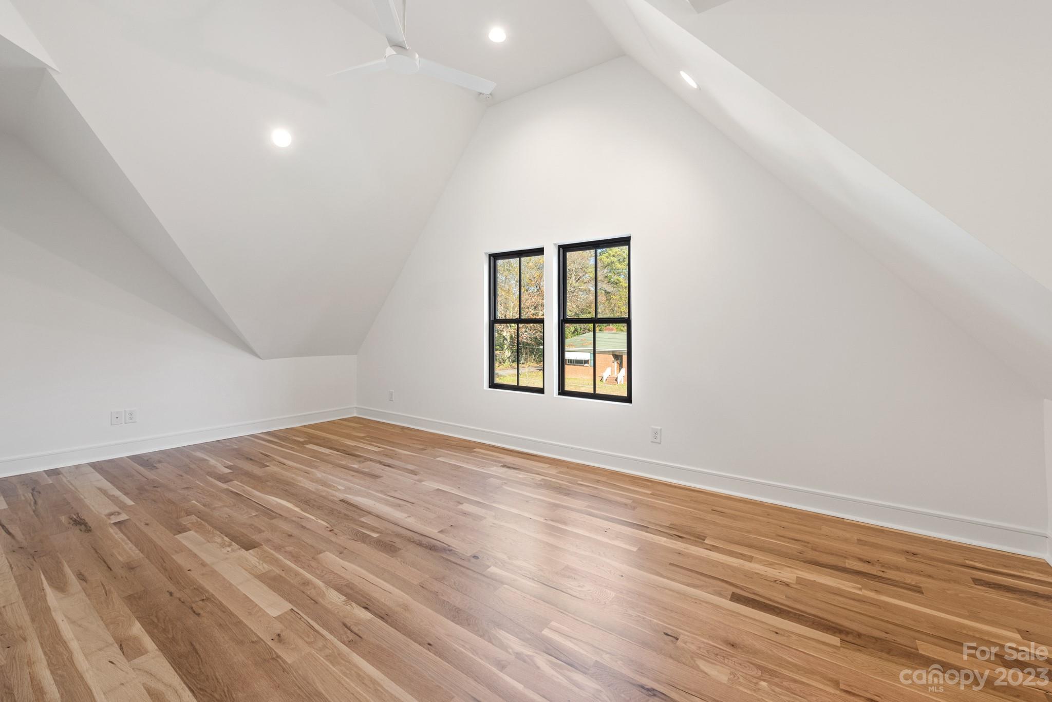 4338 Castleton Road Charlotte, NC 28211 - Photo 25 of 38 an empty room with wooden floor and windows
