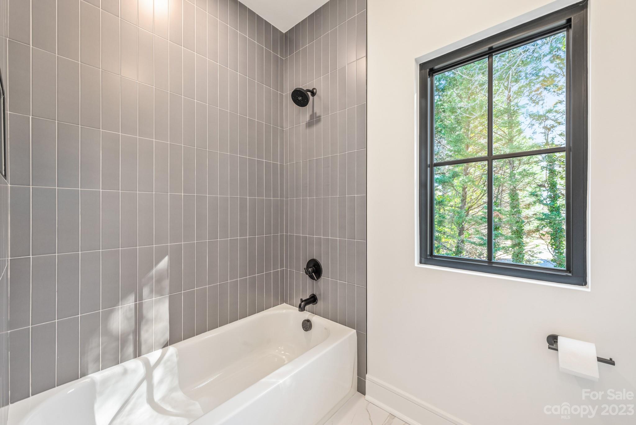4338 Castleton Road Charlotte, NC 28211 - Photo 28 of 38 a bathroom with a bathtub
