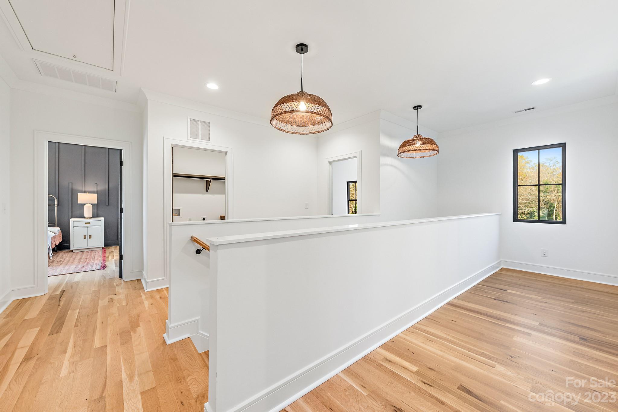 4338 Castleton Road Charlotte, NC 28211 - Photo 30 of 38 a view of a bedroom with wooden floor