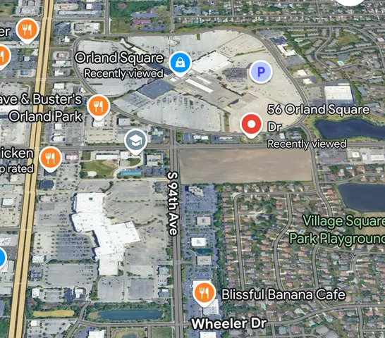 a view of a building with sitting area