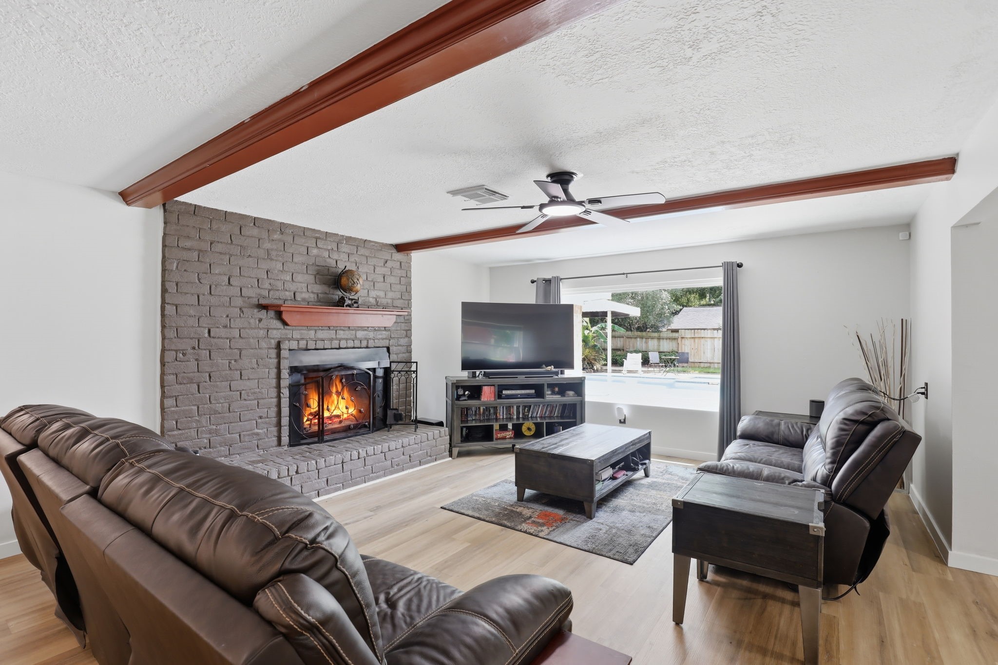25415 Friar Lake Lane Spring, TX 77373 - Photo 4 of 29 Spacious Living Room with Fireplace & Open Flow to Kitchen