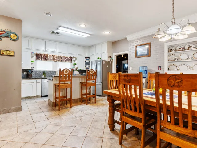 a view of a dining room with furniture