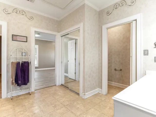 a view of a big room with closet and mirror