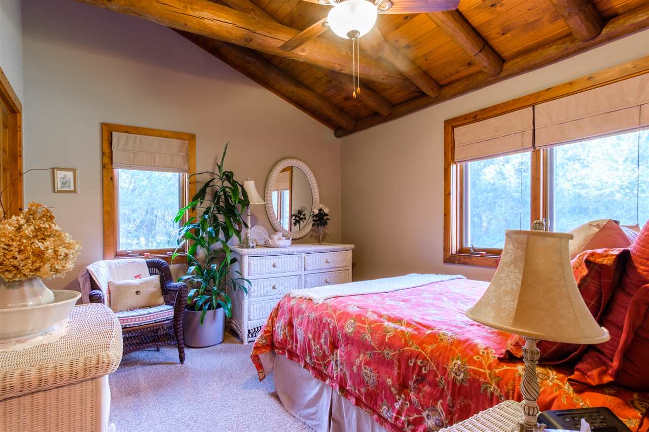 5121 Halley Road Rockford, IL 61101 - Photo 17 of 25 a bedroom with furniture and a potted plant