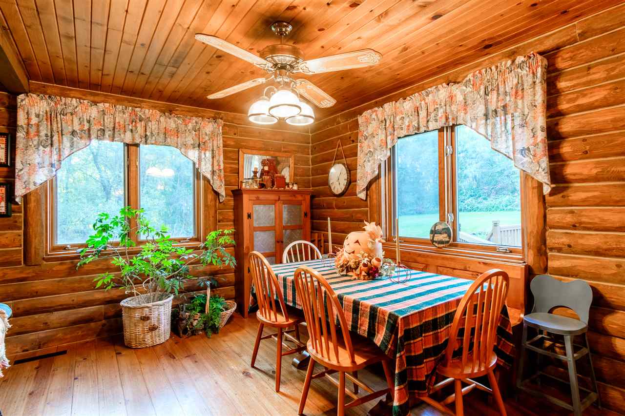 5121 Halley Road Rockford, IL 61101 - Photo 8 of 25 a dining room with furniture window and wooden floor