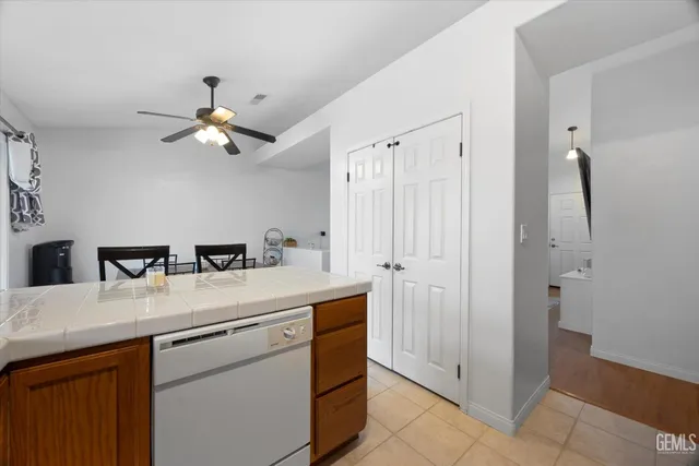 a kitchen with a sink a stove and a refrigerator