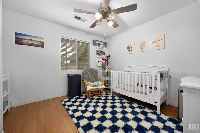 a bedroom with furniture and a window