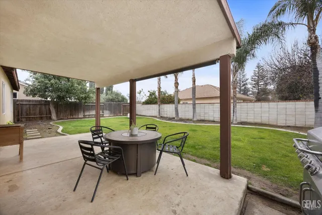 a patio with table and chairs