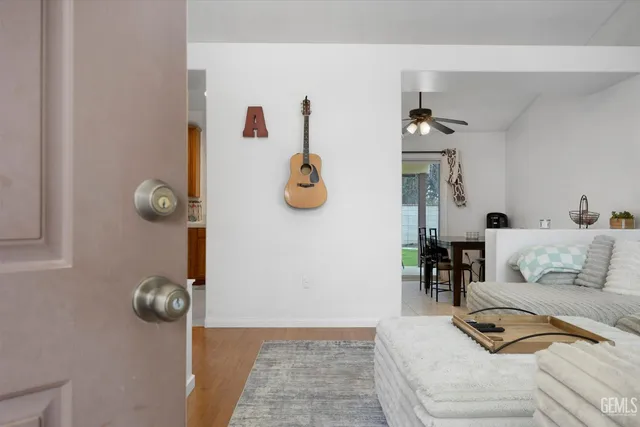 a bedroom with furniture and chandelier