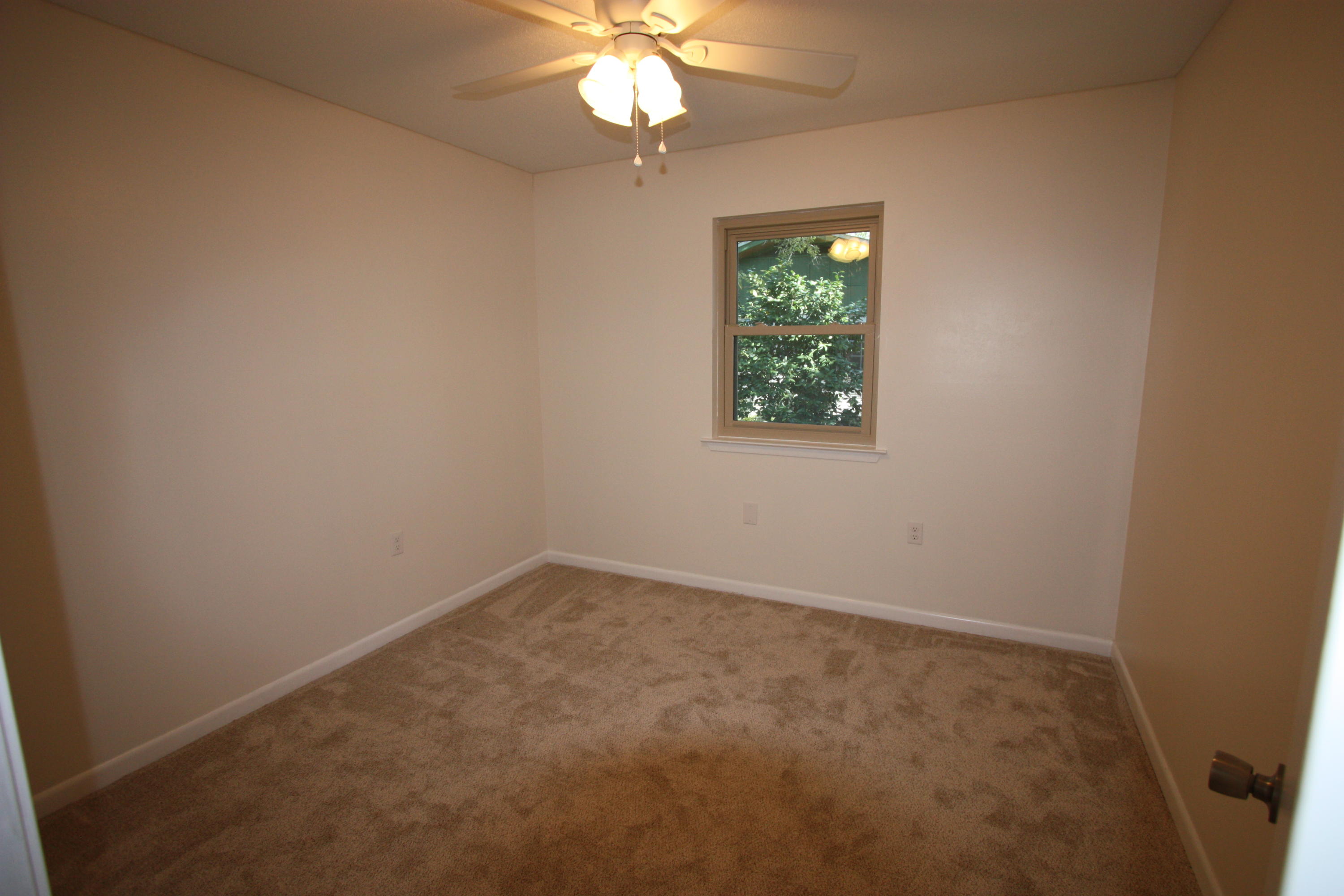 75 Country Club Road Shalimar, FL 32579 - Photo 13 of 24 an empty room with windows and fan