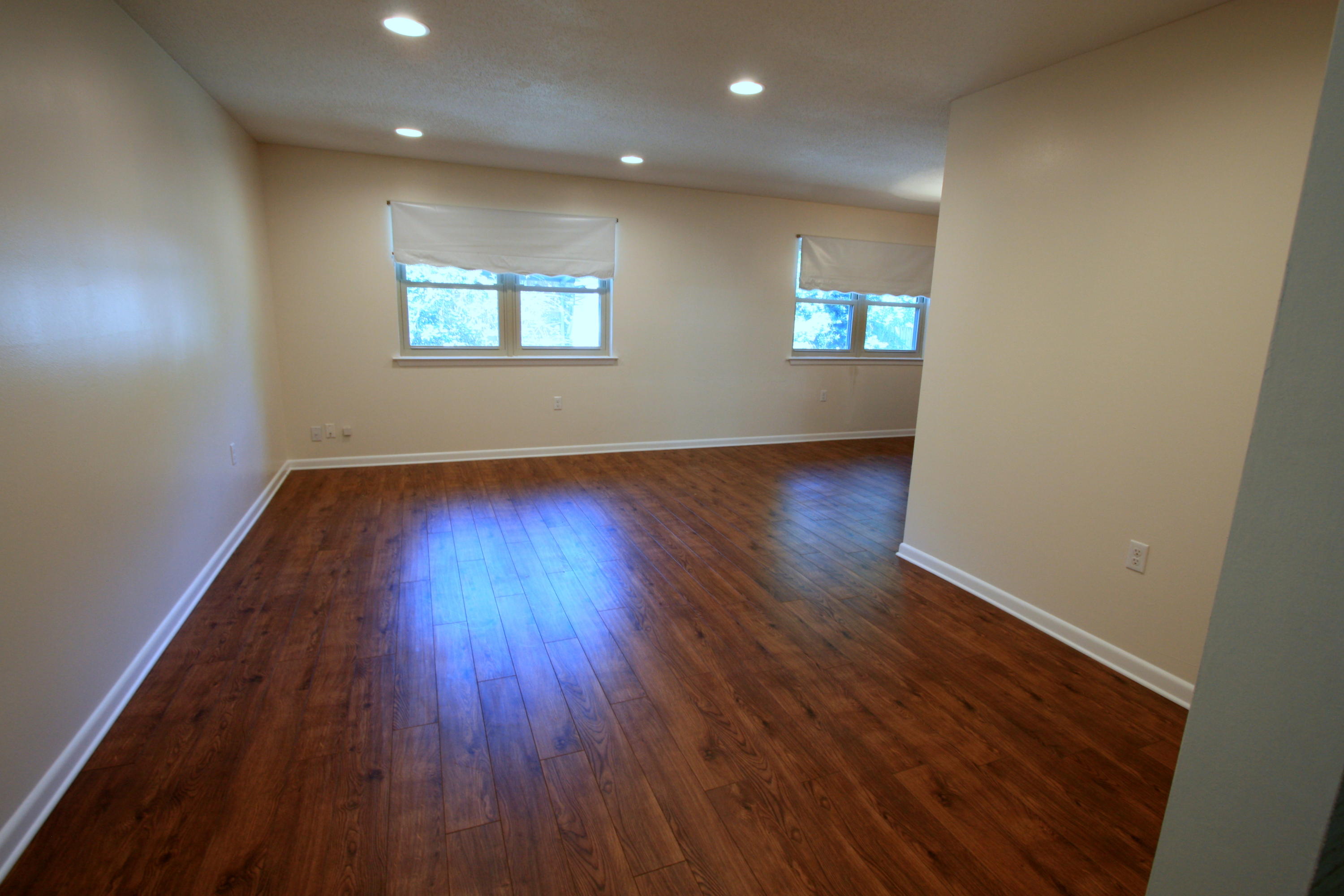 75 Country Club Road Shalimar, FL 32579 - Photo 3 of 24 an empty room with wooden floor and windows