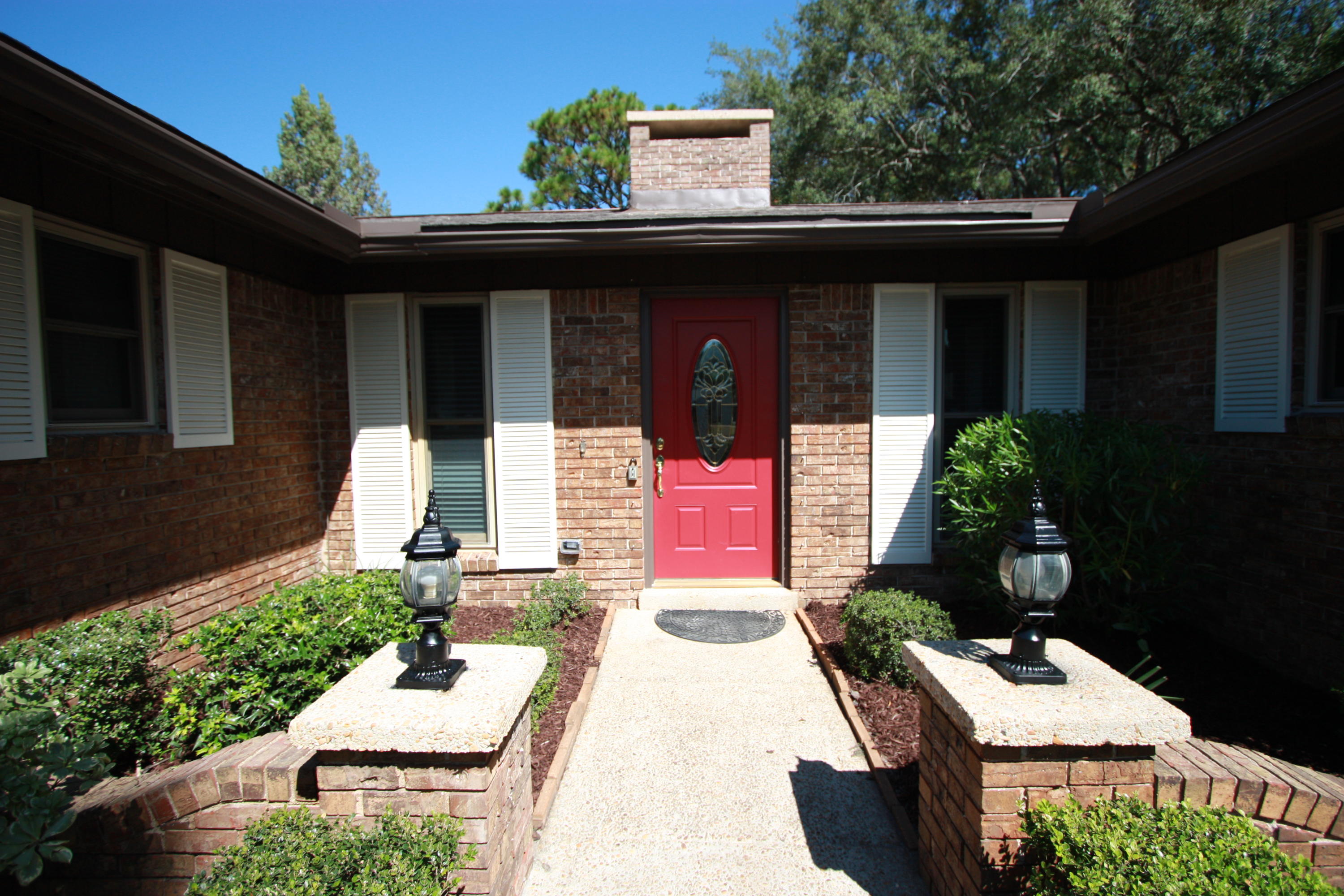 75 Country Club Road Shalimar, FL 32579 - Photo 21 of 24 a front view of a house with a yard