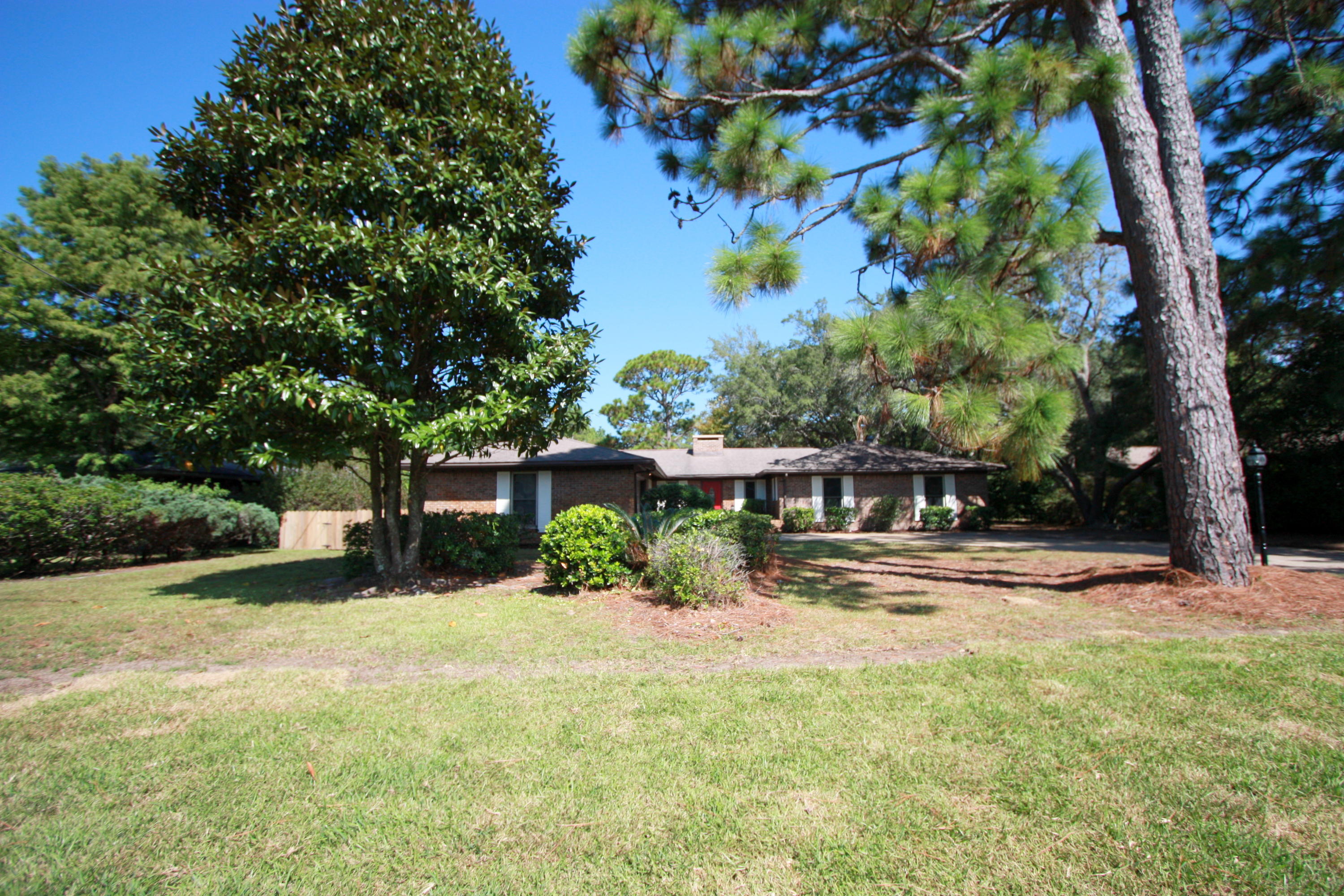 75 Country Club Road Shalimar, FL 32579 - Photo 23 of 24 front view of a house with a yard