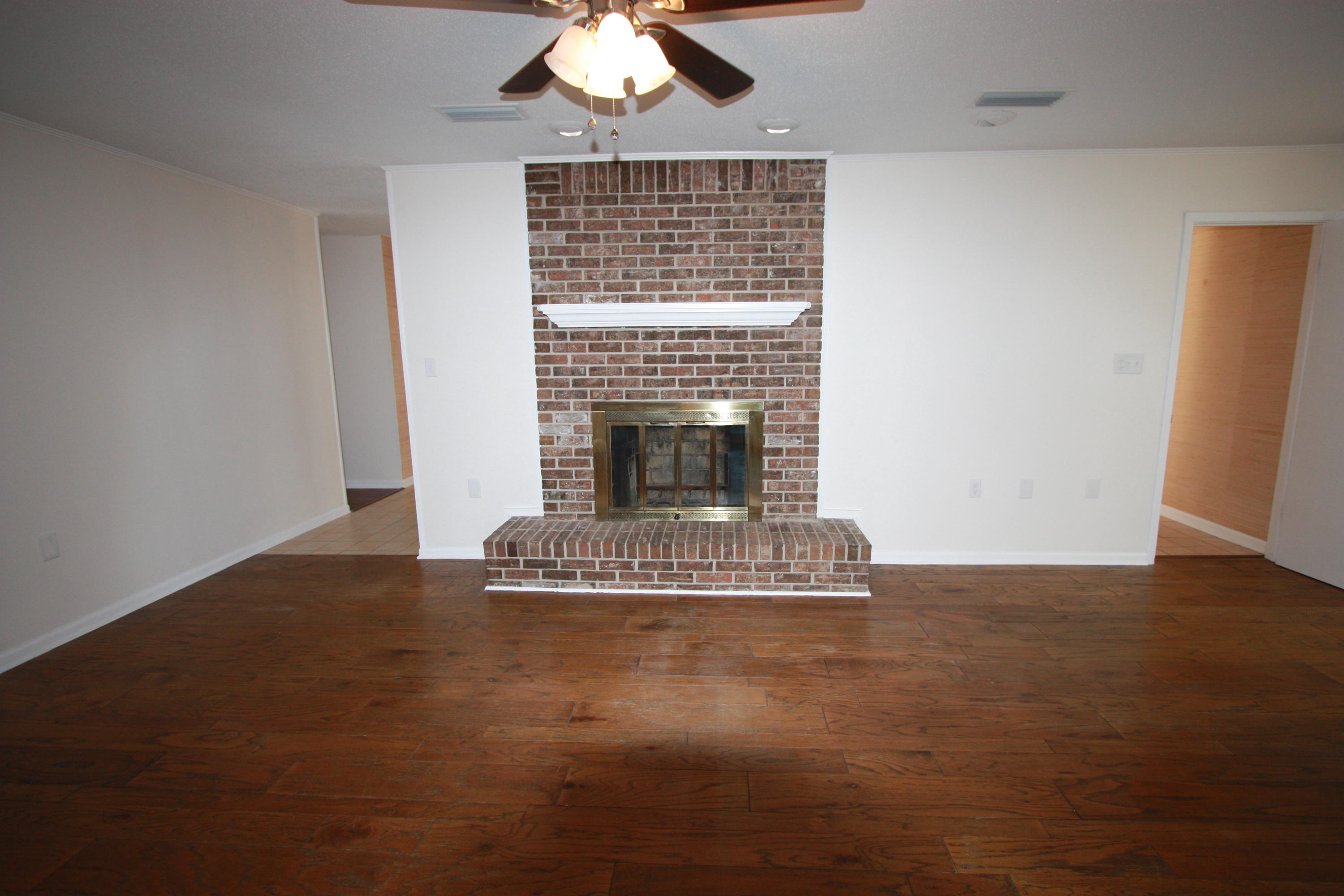 75 Country Club Road Shalimar, FL 32579 - Photo 8 of 24 a living room with furniture and a fireplace