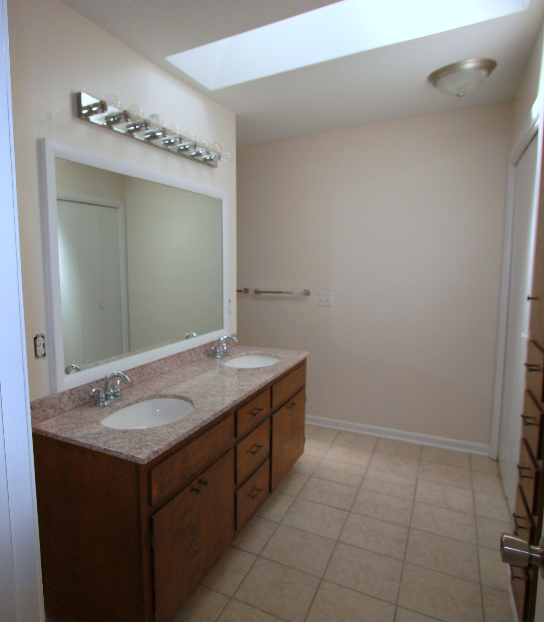 75 Country Club Road Shalimar, FL 32579 - Photo 10 of 24 a bathroom with a sink vanity and a mirror