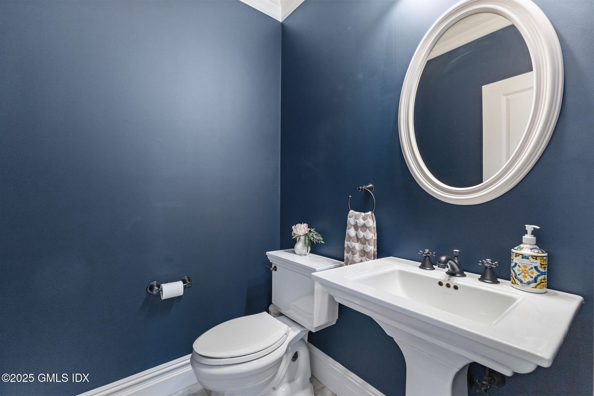 26 Church Street, Unit B Greenwich, CT 06830 - Photo 13 of 30 a bathroom with a sink and mirror