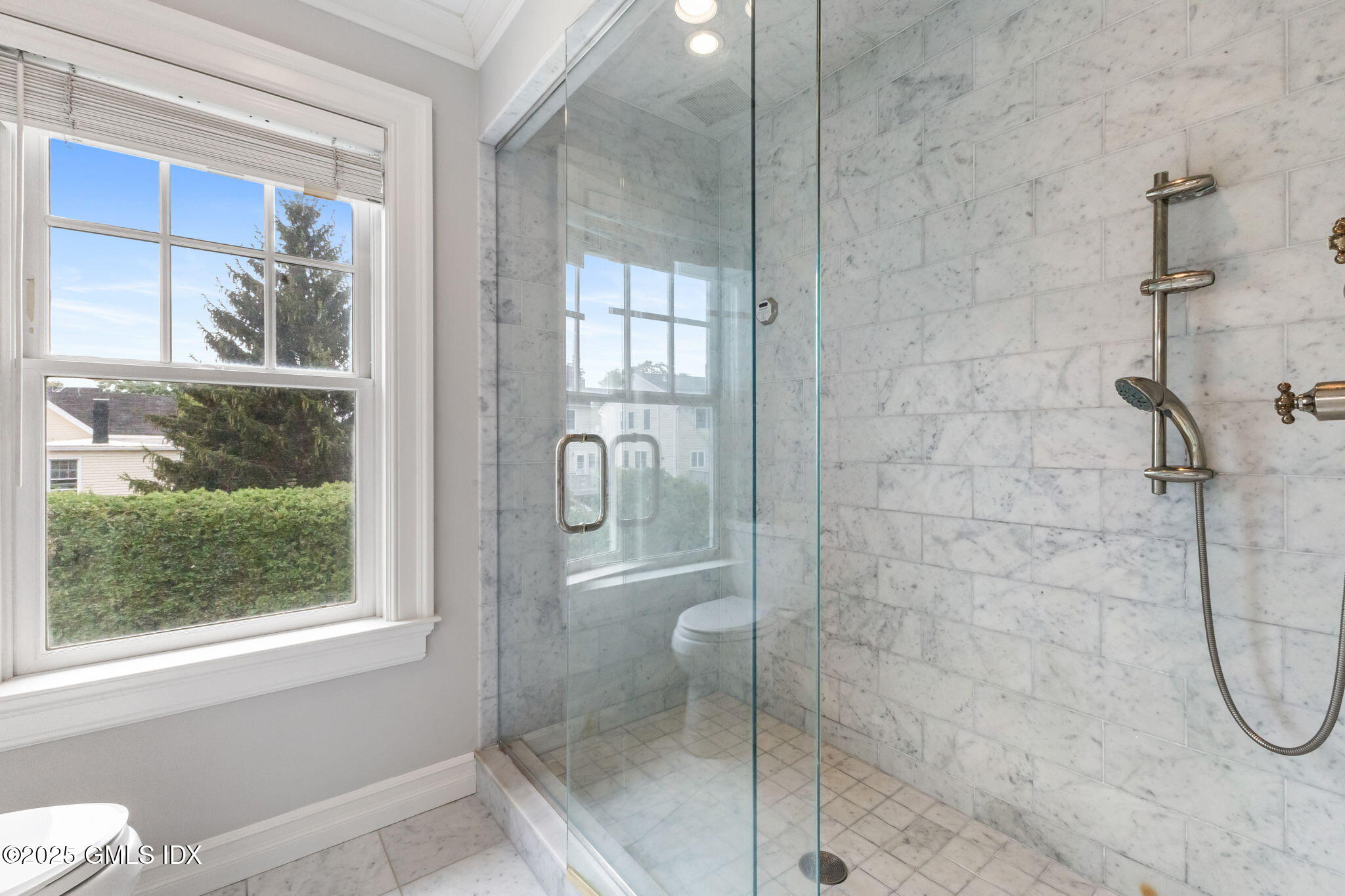 26 Church Street, Unit B Greenwich, CT 06830 - Photo 19 of 30 a bathroom with a glass shower door