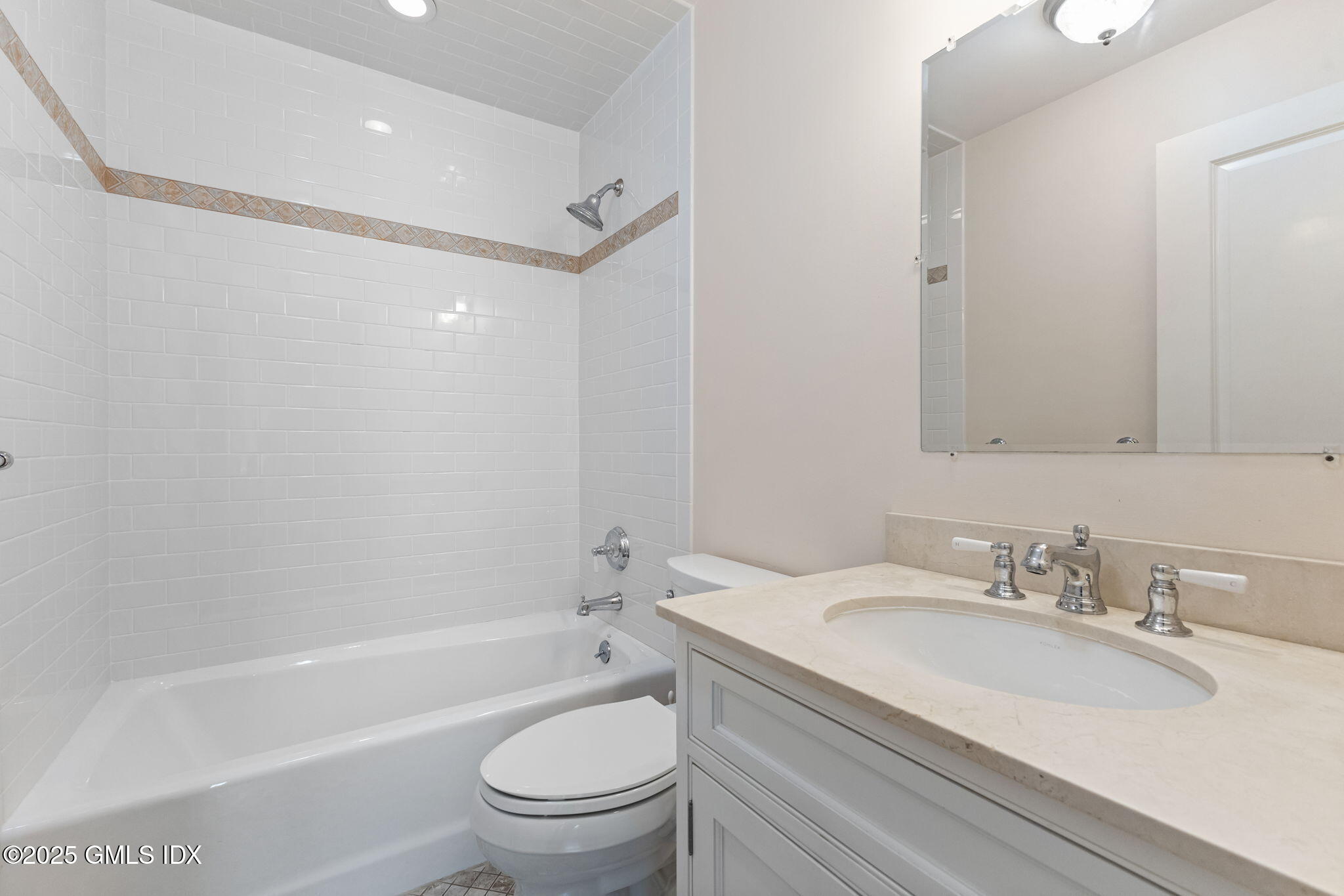 26 Church Street, Unit B Greenwich, CT 06830 - Photo 27 of 30 a bathroom with a granite countertop sink toilet and shower