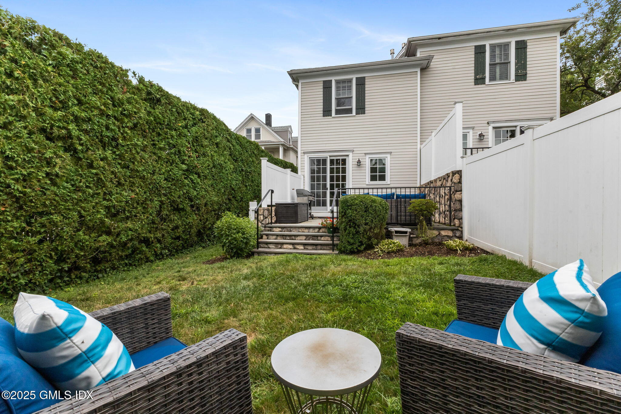 26 Church Street, Unit B Greenwich, CT 06830 - Photo 30 of 30 a view of a patio with couches chairs and a fire pit