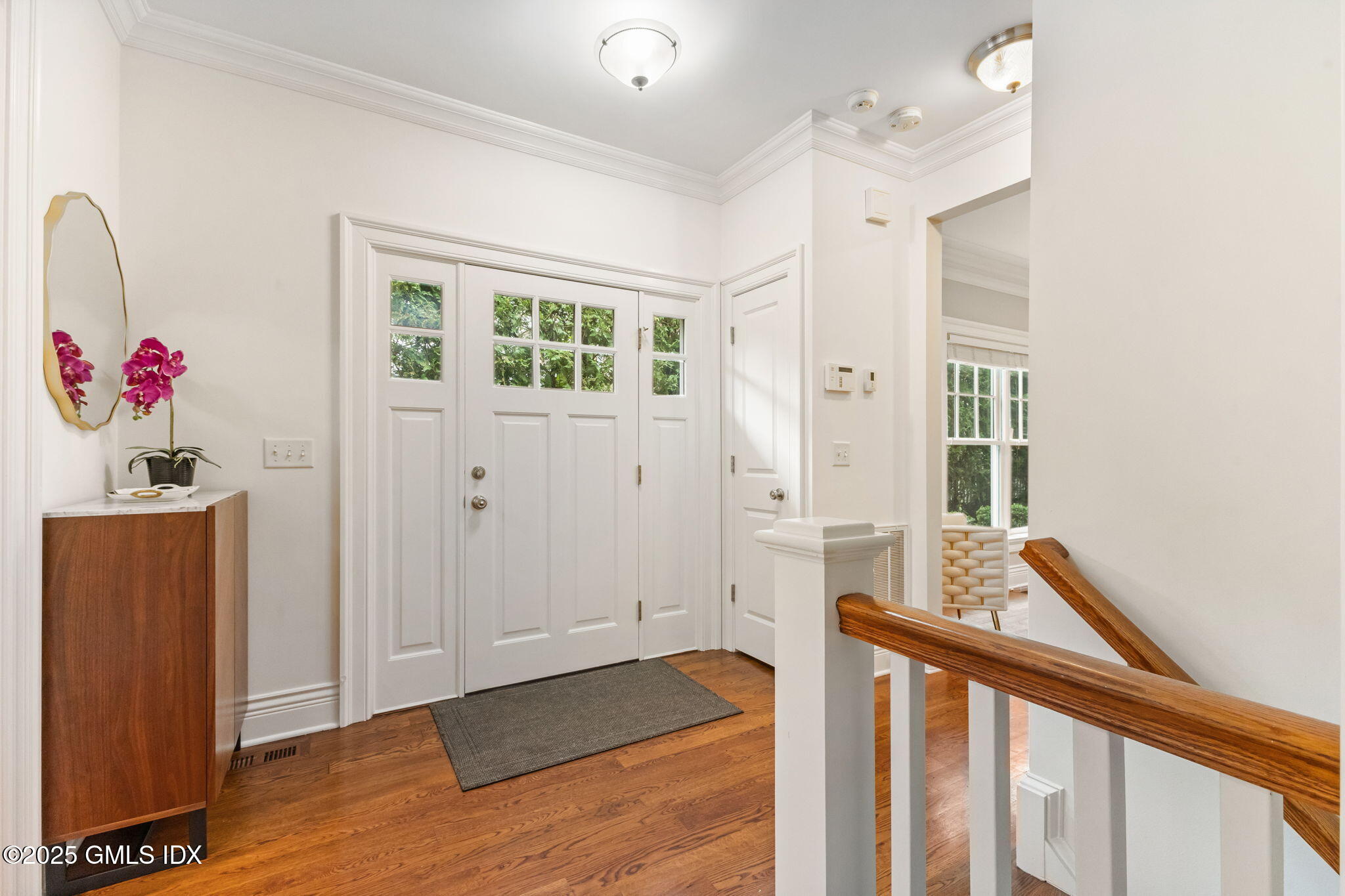 26 Church Street, Unit B Greenwich, CT 06830 - Photo 5 of 30 a view of a hallway with wooden floor and staircase
