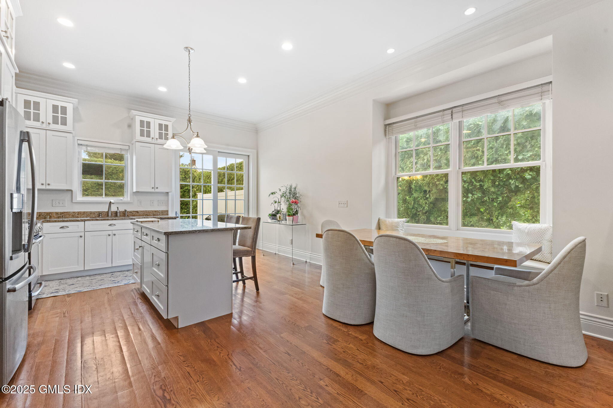 26 Church Street, Unit B Greenwich, CT 06830 - Photo 7 of 30 a living room with furniture and large windows