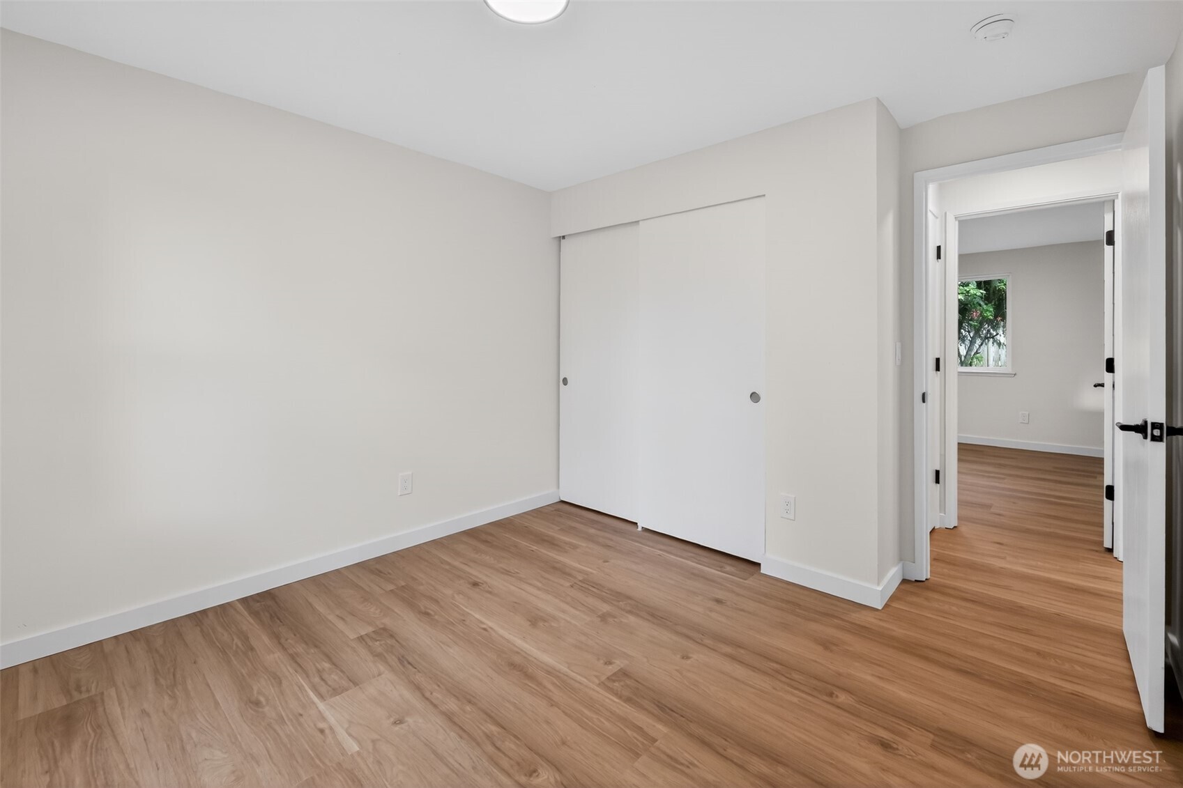 320 213th Place Southwest Bothell, WA 98021 - Photo 22 of 29 wooden floor in a hall with an empty room