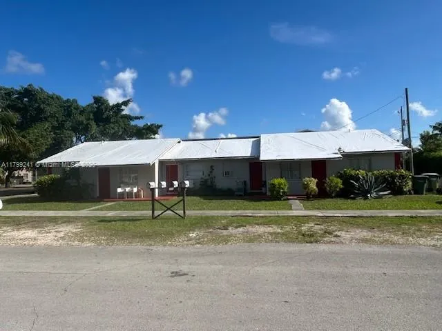 a house view with a sitting space and garden space