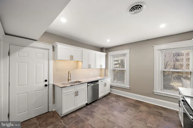 a view of a kitchen with electric appliances