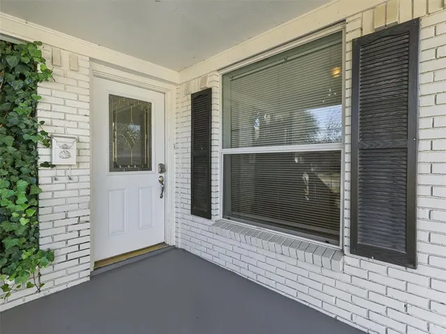 a kitchen with stainless steel appliances granite countertop wooden cabinets a stove top oven a sink and dishwasher a oven with wooden floor