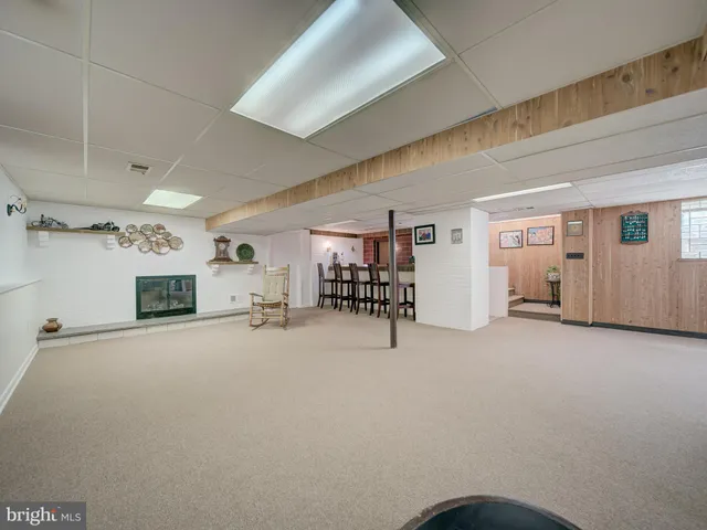 a view of a livingroom with furniture and a fireplace
