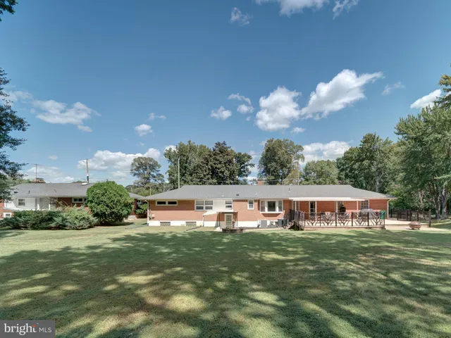 a view of house with outdoor space and car parked
