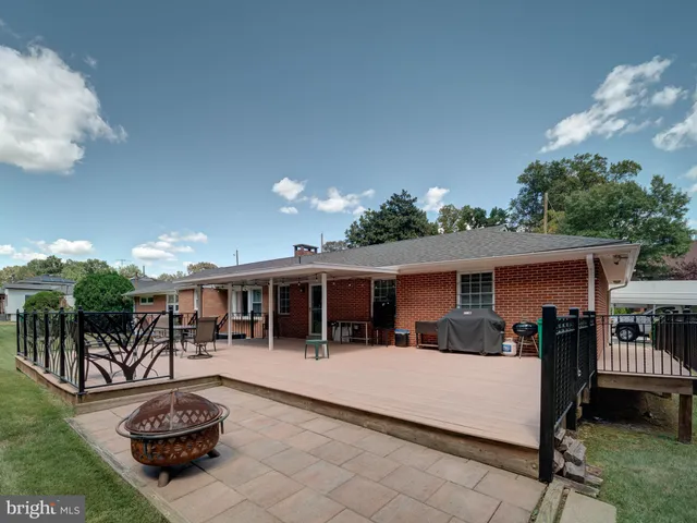 a house view with a seating space and a kitchen view