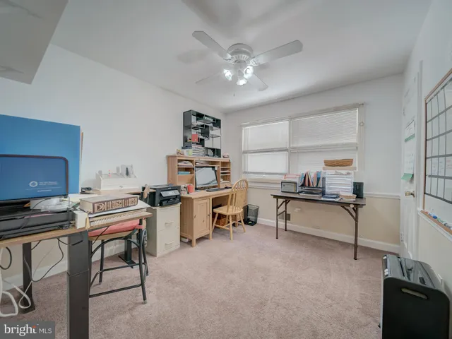 a view of a workspace with furniture