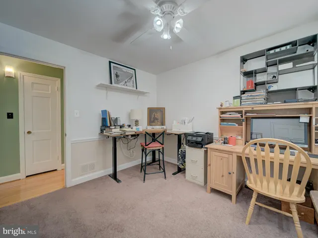 a bedroom with furniture and a chair