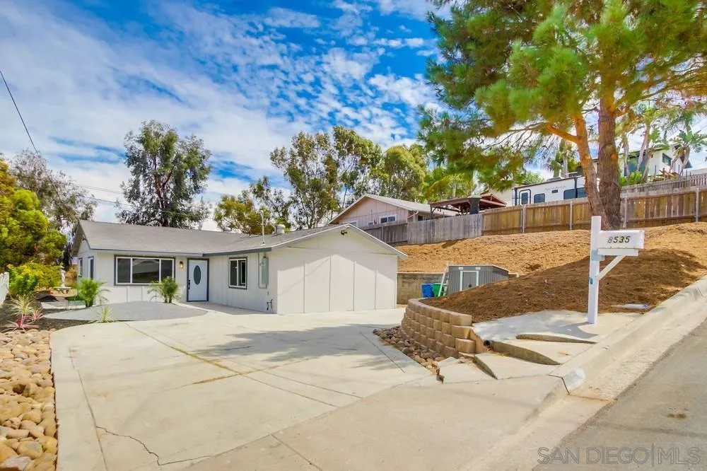 a house with trees in front of it