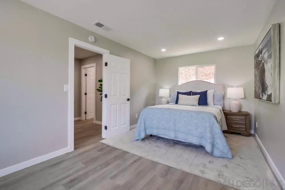 8535 Dobyns Drive Santee, CA 92071 - Photo 21 of 36 a bedroom with a bed and wooden floor