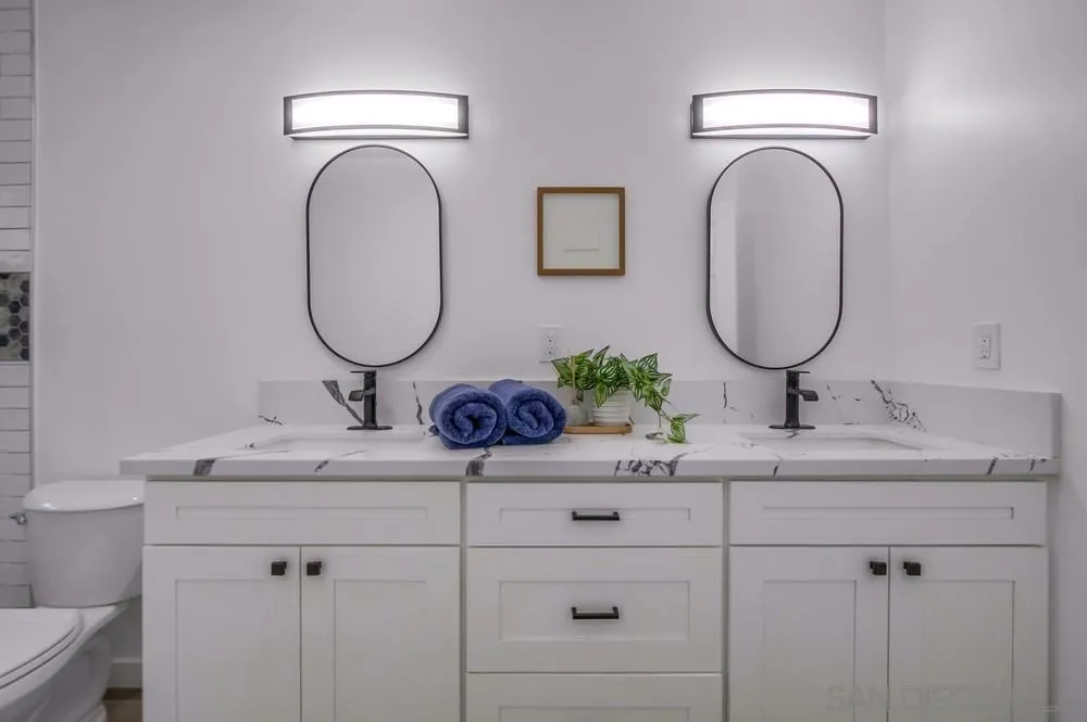 8535 Dobyns Drive Santee, CA 92071 - Photo 23 of 36 a bathroom with a sink and a mirror
