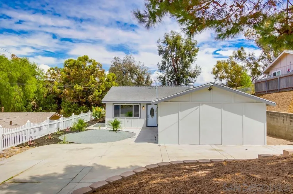 8535 Dobyns Drive Santee, CA 92071 - Photo 5 of 36 a front view of a house with a yard and garage