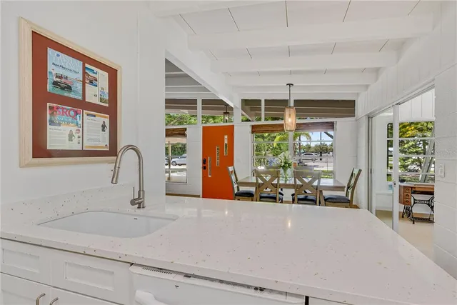 a kitchen with a sink and a large window