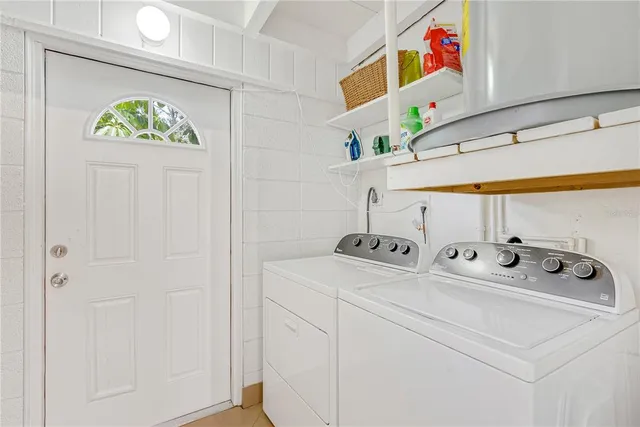 a utility room with washer and dryer
