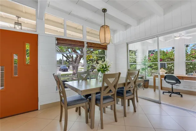 a view of a dining room with furniture window and outside view