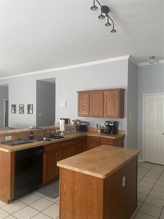 9733 Old Field Drive McKinney, TX 75072 - Photo 7 of 12 a kitchen with a sink a stove top oven and cabinets