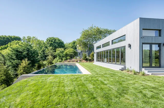 a view of swimming pool with outdoor seating