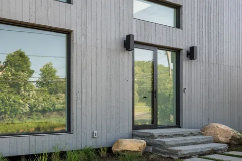 a view of backyard with swimming pool and outdoor seating