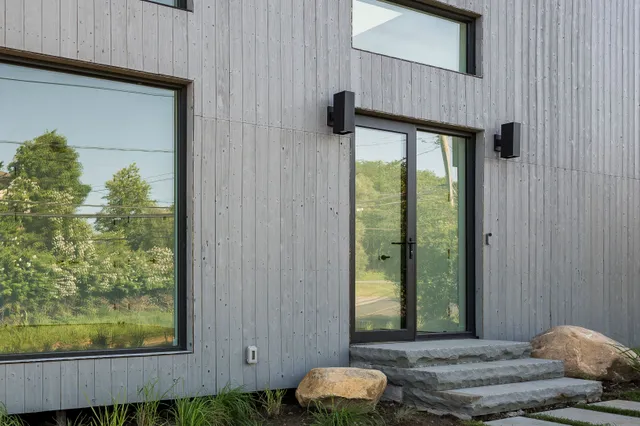 a view of backyard with swimming pool and outdoor seating