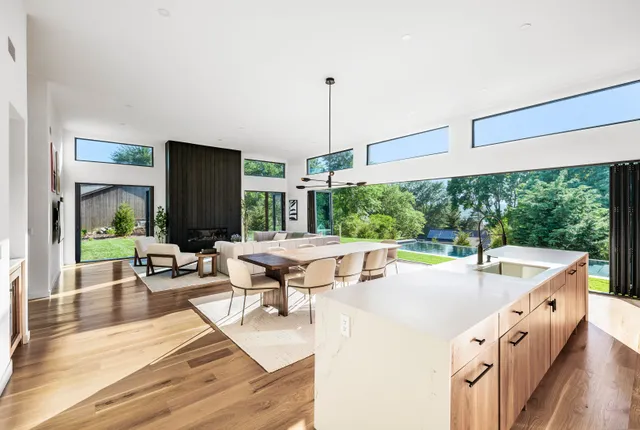 a kitchen with stainless steel appliances granite countertop a stove and a refrigerator
