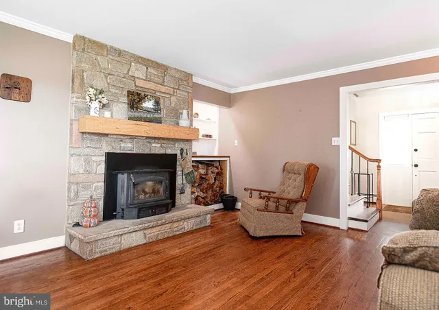 a view of a livingroom with furniture and a fireplace