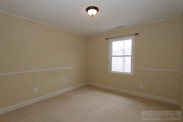 993 Hopewell Church Road Boone, NC 28607 - Photo 3 of 15 an empty room with a window